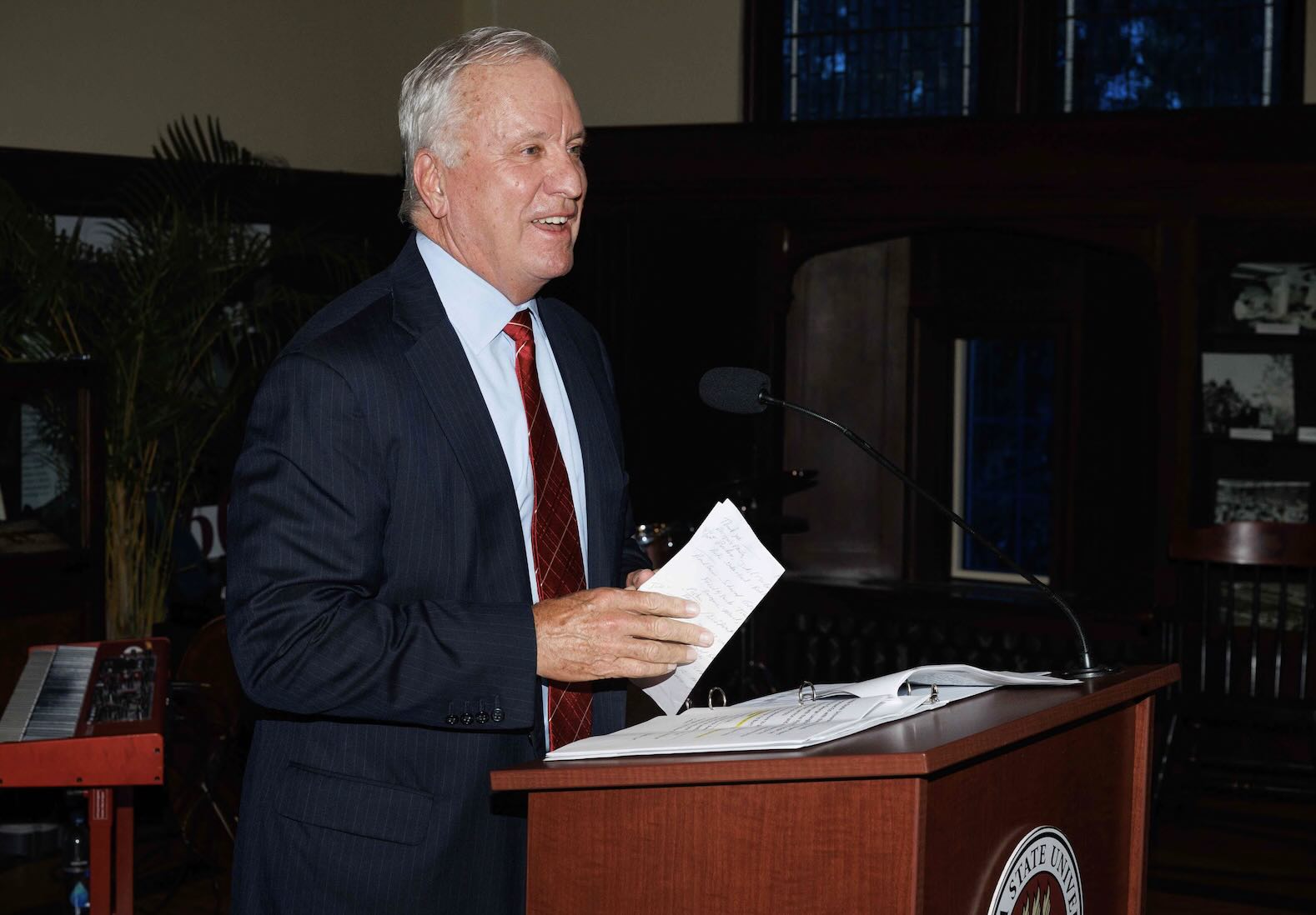 Ed Burr standing at podium receiving award