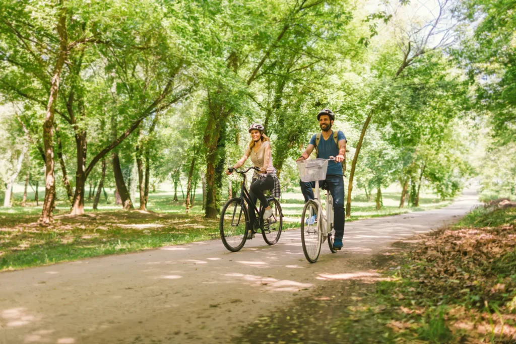 Couple enjoying bike ride on canopy trail